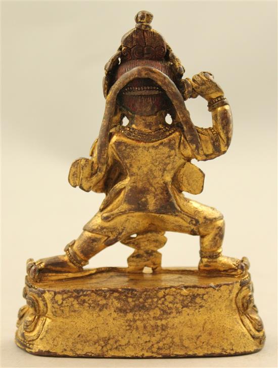 A Tibetan gilt copper bronze figure of Mahakala, 18th / 19th century, 10.5cm.